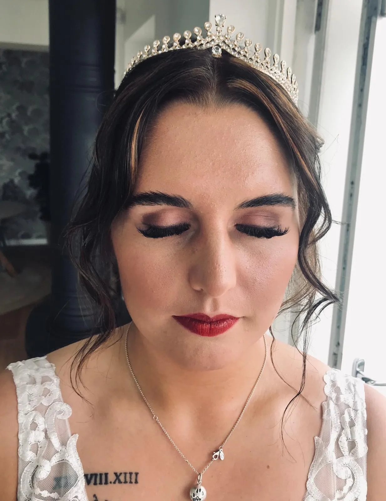 Bride wearing a tiara with warm, defined makeup